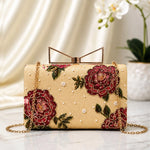 Burgundy Rose Printed Highlight Clutch with elegant burgundy rose floral artwork on a beige base, gold-tone frame clasp, detachable chain, and premium designer finish.