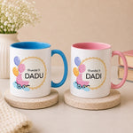 Personalized Promoted To Grandparents ceramic coffee mug with blue handle featuring custom baby announcement design for Dadu and Dadi