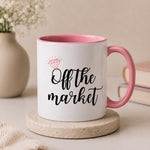 Off The Market coffee mug with pink handle featuring a diamond ring design, perfect engagement gift for brides-to-be.