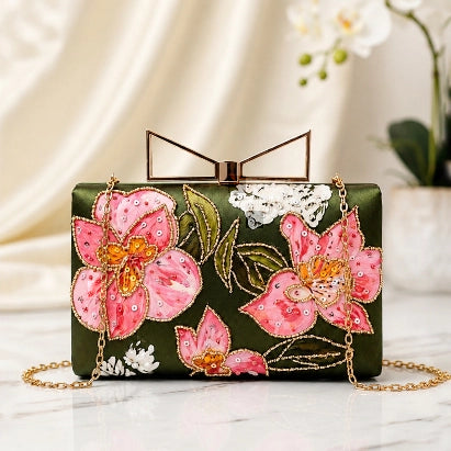 Olive Floral Elegance Printed Highlight Clutch featuring pink floral artwork with printed highlights, gold chain strap, and premium clasp