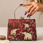 Printed Maroon Elephant Embellished Handle Clutch