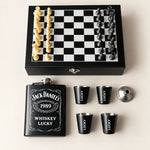 The Classic Gentleman Chess Gift Set featuring a personalized black flask, matching shot glasses and chess set arranged in a premium wooden presentation box.