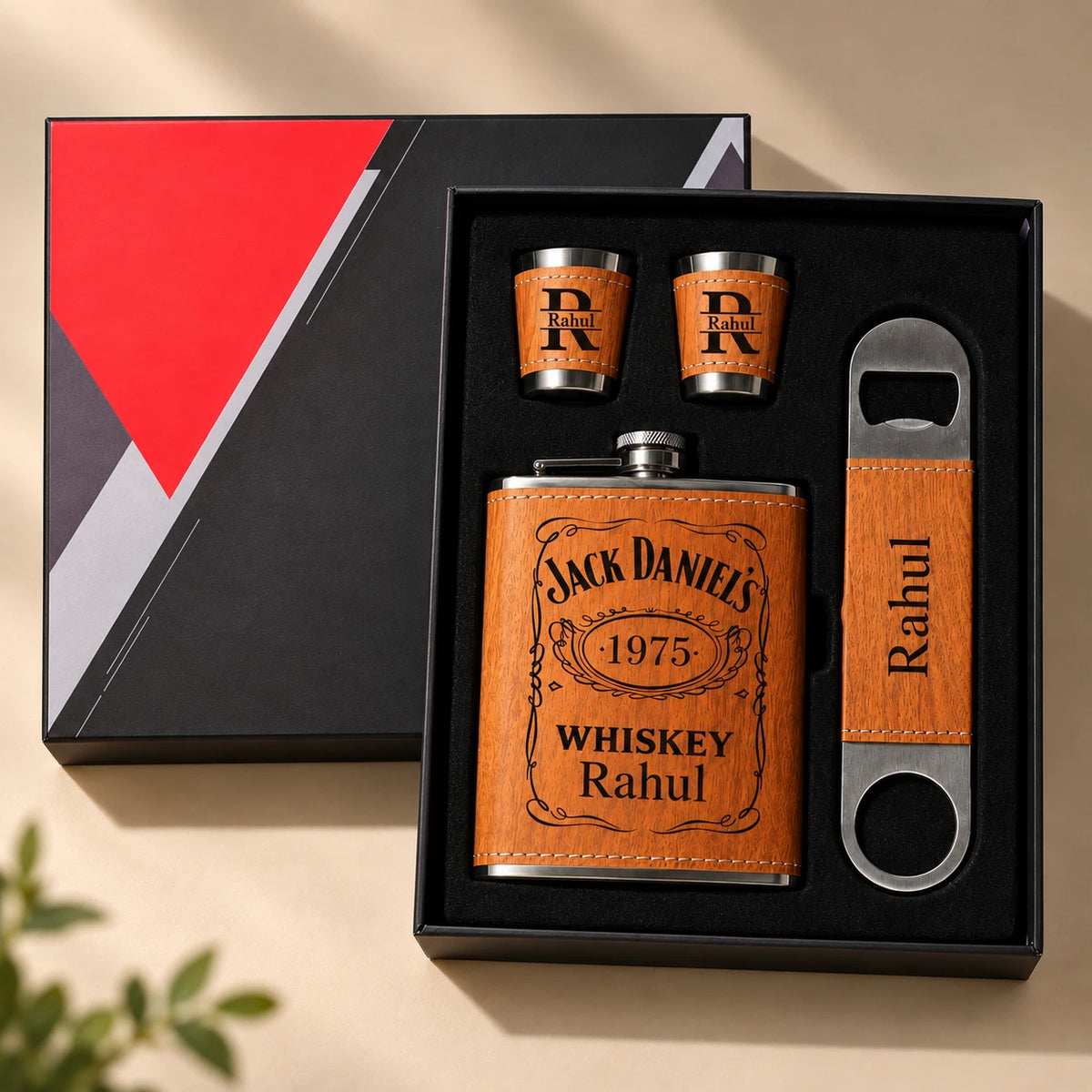 Personalized whiskey flask gift set with two shot glasses and bottle opener in a premium black gift box