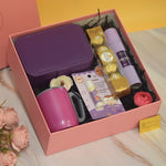 The Lavender Luxe Hamper featuring a premium jewellery organizer, mini storage pouch, body mist, nail polish, Ferrero Rocher chocolates, decorative floral accents, and elegant luxury gift packaging by YelloWraps.