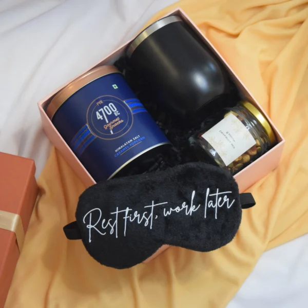Munch and Relax Hamper is a gift set for men or women with gourmet popcorn, tumbler, sleep mask and trial mix