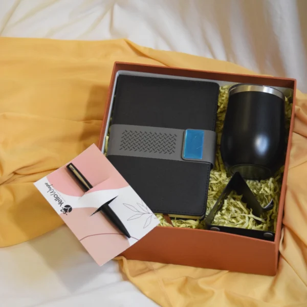 Workday Essentials Hamper With book pen travel mug and phone stand