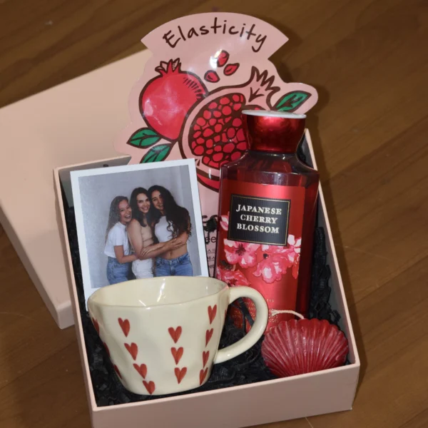 Love and Glow self care gift hamper with body wash, face sheet mask, coffee mug, scented candle and personalised polaroid photo