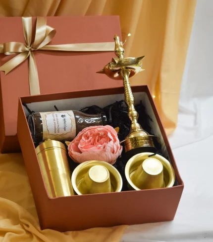 Traditional brass coffee dabara set with tumbler, authentic filter coffee powder, and brass diya for housewarming gift. Golden Heritage Home Gift