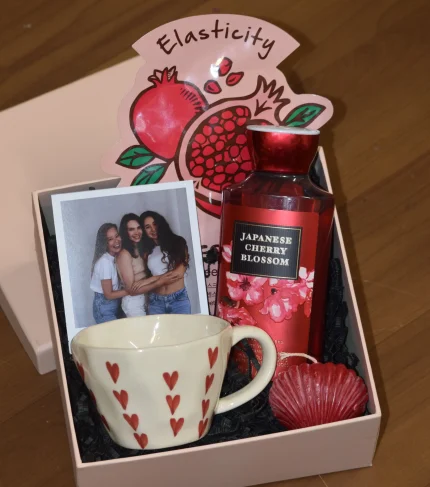 Love and Glow self care gift hamper with body wash, face sheet mask, coffee mug, scented candle and personalised polaroid photo